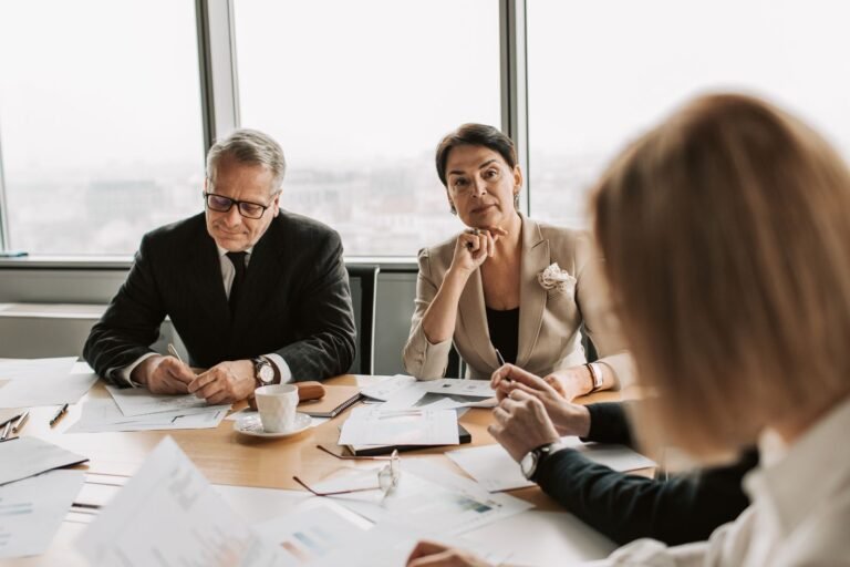 Business professionals in discussion during a meeting in a modern office