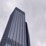 Modern high-rise building seen from below in a city business district