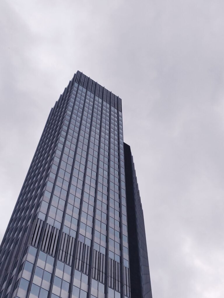Modern high-rise building seen from below in a city business district