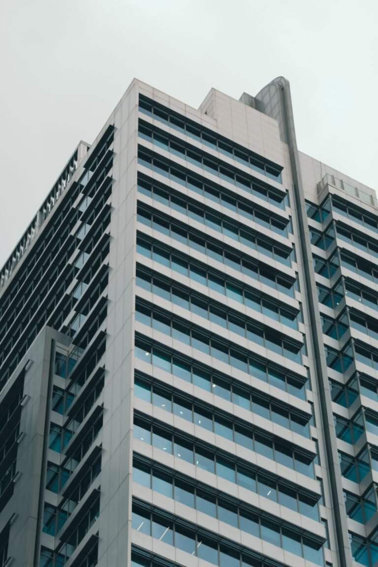 Low angle view of a modern glass facade office building