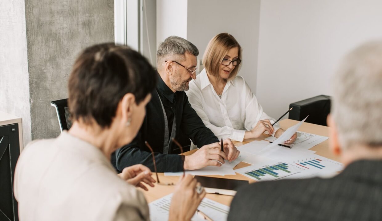 Team of professionals analyzing financial documents for business strategy