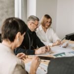 Team of professionals analyzing financial documents for business strategy