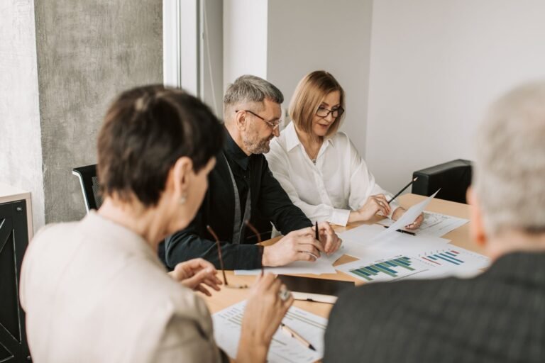 Team of professionals analyzing financial documents for business strategy