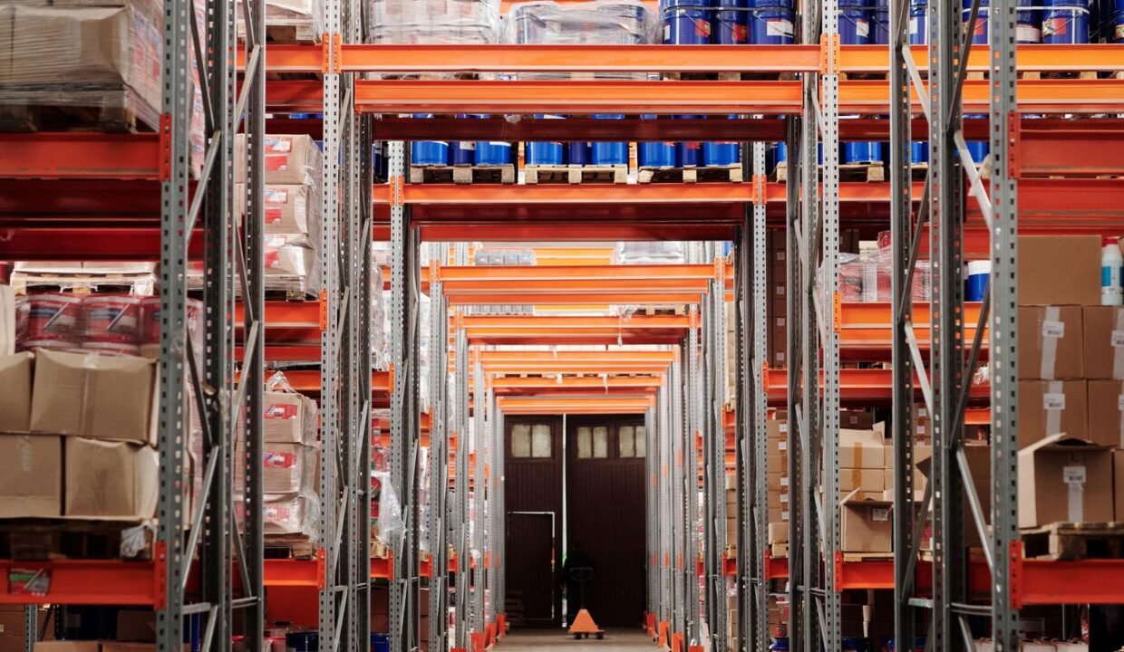 Modern warehouse interior with organized shelves and pallets for storage