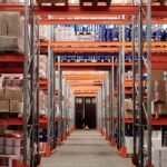 Modern warehouse interior with organized shelves and pallets for storage