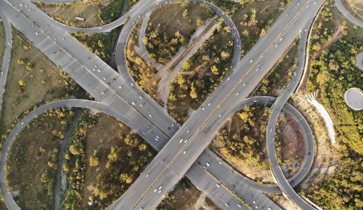 Aerial view of a highway interchange and green spaces in Islamabad