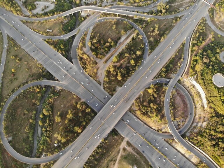 Aerial view of a highway interchange and green spaces in Islamabad