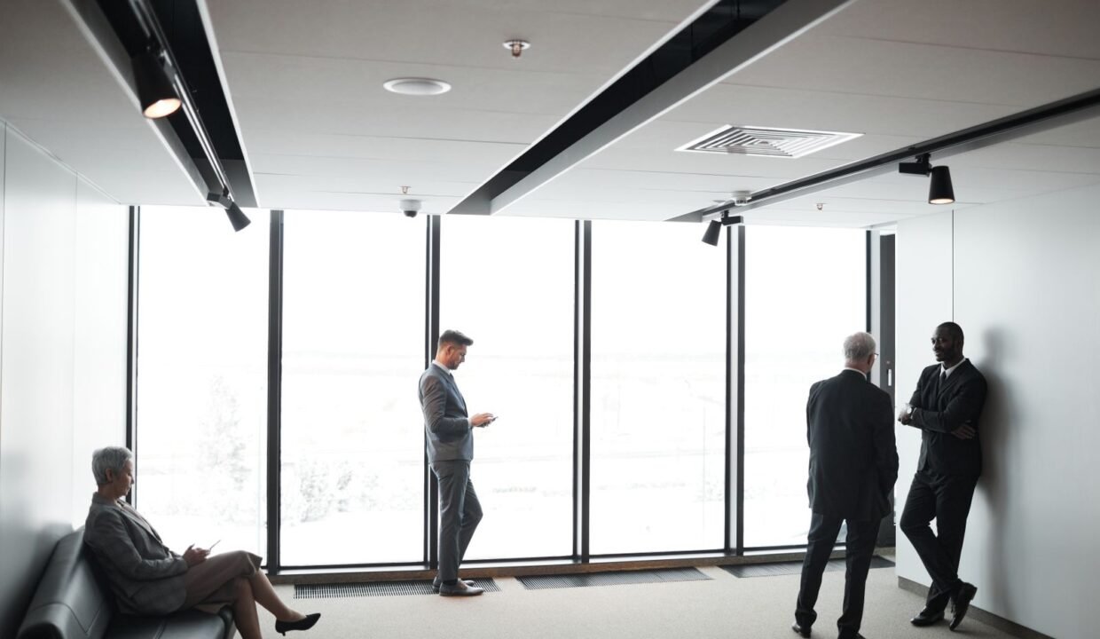 Business professionals meeting in a modern office to discuss corporate real estate