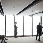 Business professionals meeting in a modern office to discuss corporate real estate