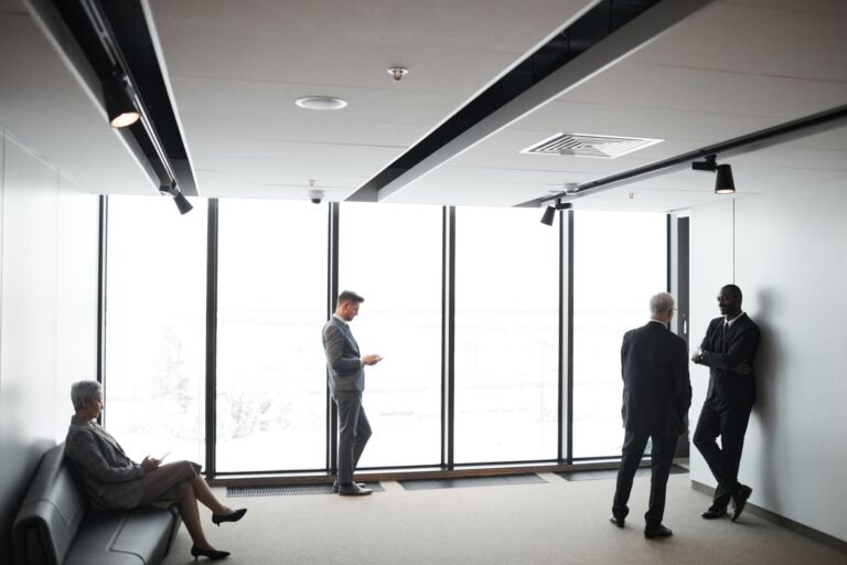 Business professionals meeting in a modern office to discuss corporate real estate
