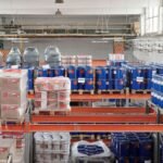 Large warehouse interior with organized goods on shelves